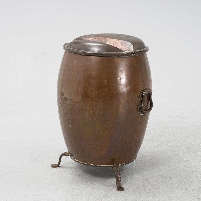 A copper water container, on iron stands.19th Century.