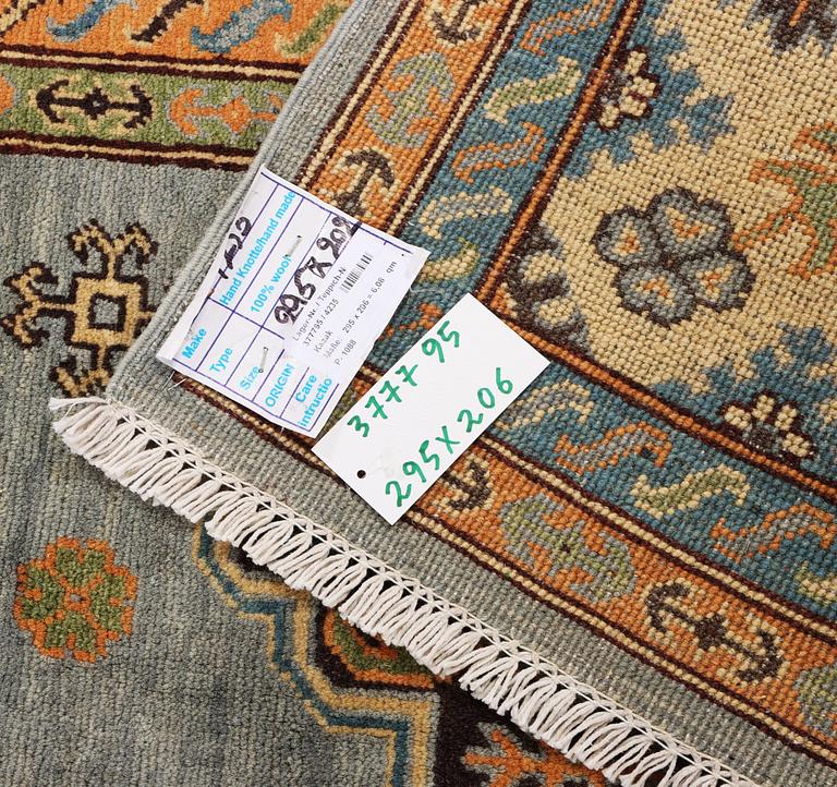 A Kazak carpet, c. 295 x 206 cm.