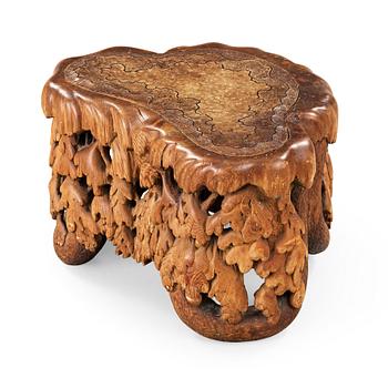 389. Knut Fjaestad, an Art Nouveau sculptured pine table/stool, Sweden ca 1900.