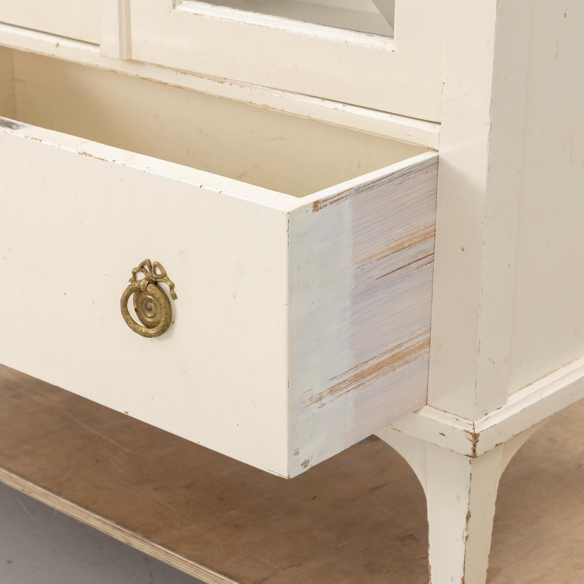 A display cabinet, early 20th century.