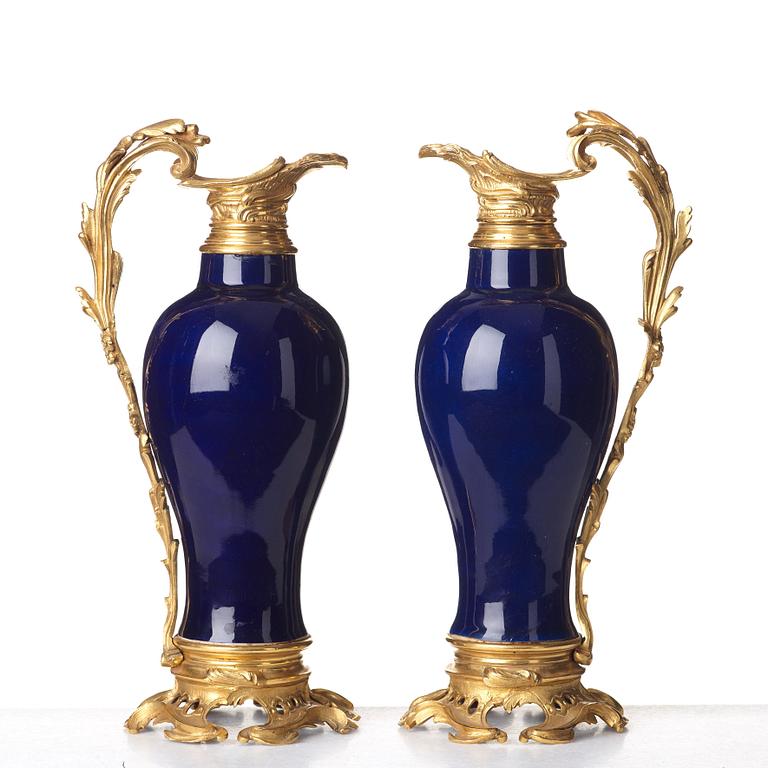 A pair of gilt bronze mounted vases, Qing dynasty, Qianlong (1736-95). French bronze mounts.