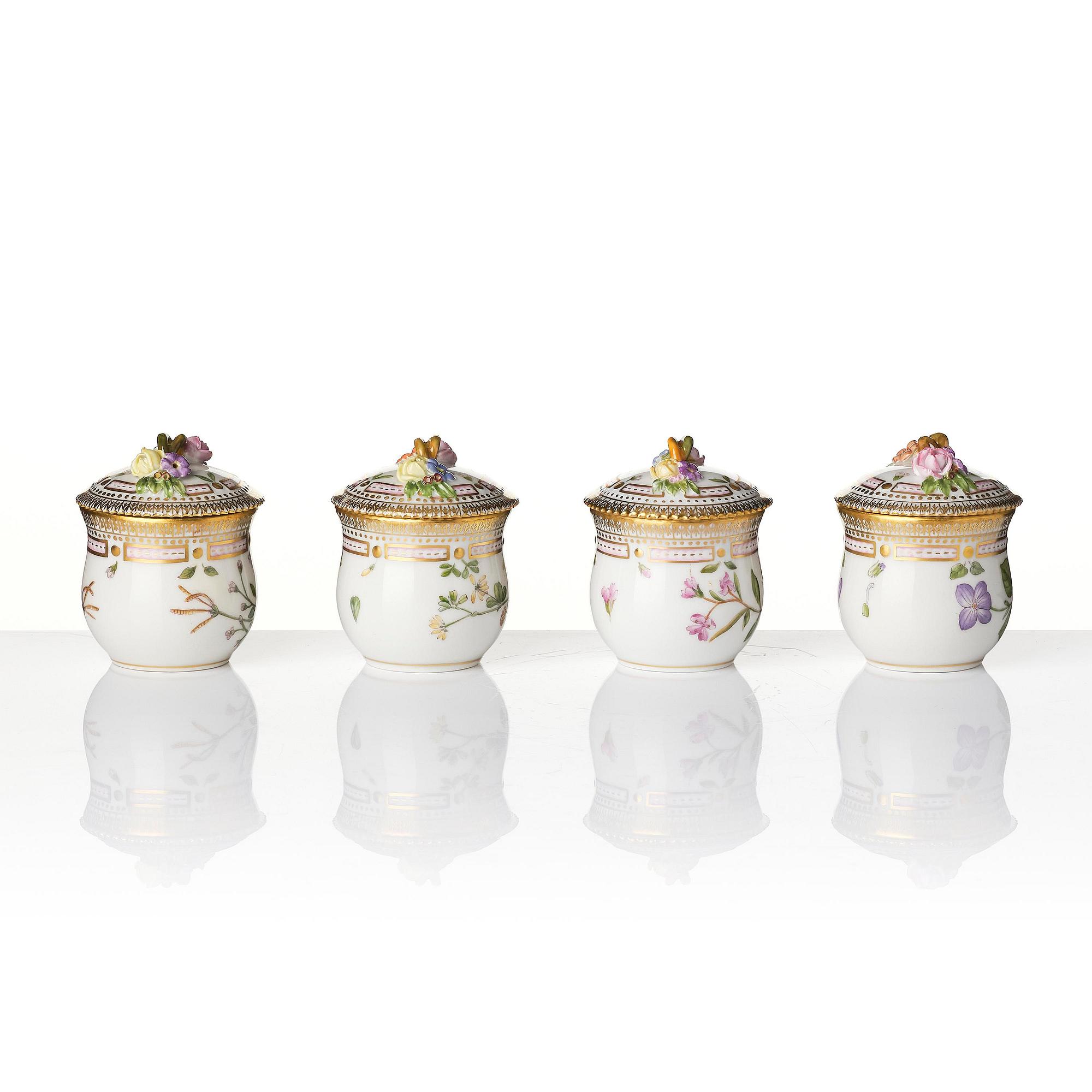 A set with four Royal Copenhagen 'Flora Danica' custard cups with covers and stands, Denmark, 20th century.