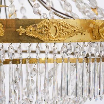 An French Empire eight-light gilt-brass and cut-glass chandelier.