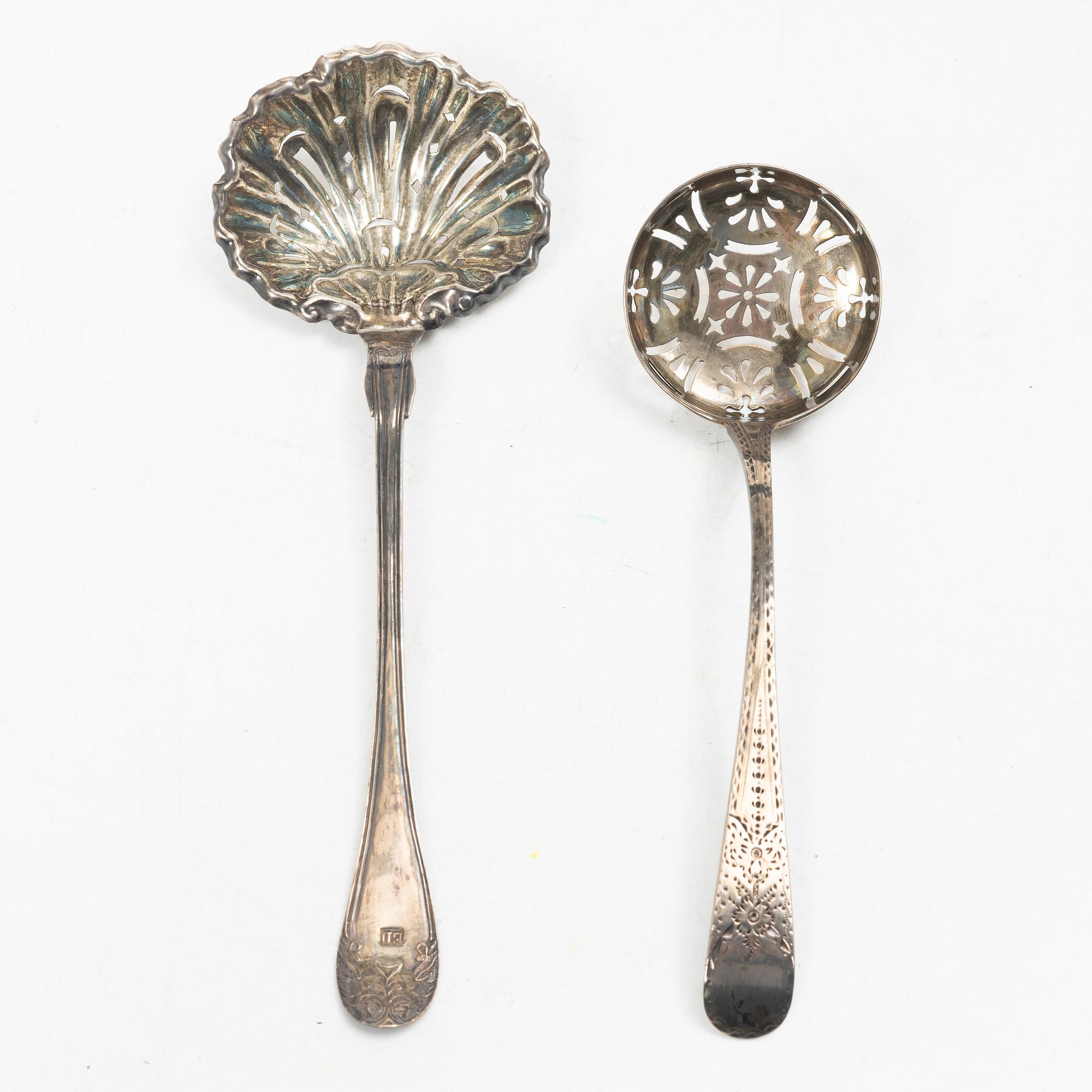 Two pierced silver bowls and two sugar spoons, including Sweden and Endland, 20th century.