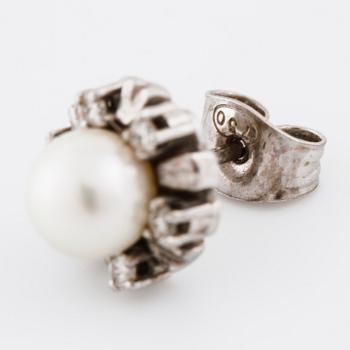 A pair of cultured pearl and brilliant cut diamond earrings.