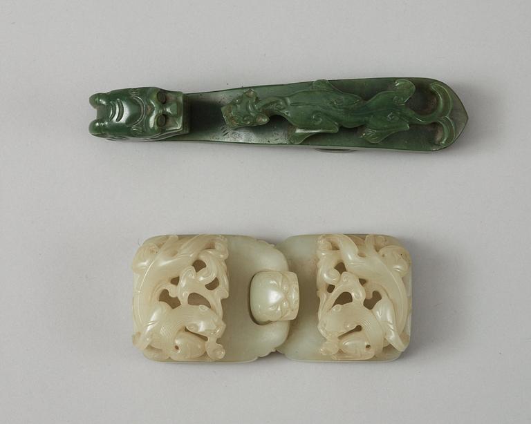 Two Chinese carved nephrite belt buckles.