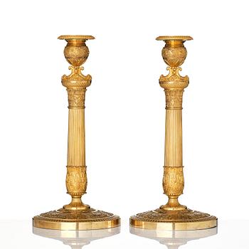 A pair of French Empire candlesticks, early 19th century.