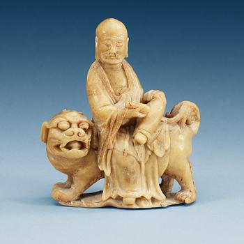 A carved stone figure, late Qing dynasty (1644-1912).