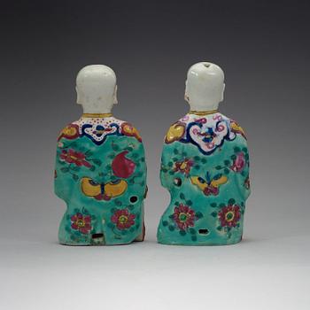 Two famille rose "laughing boys", Qing dynasty, circa 1800.