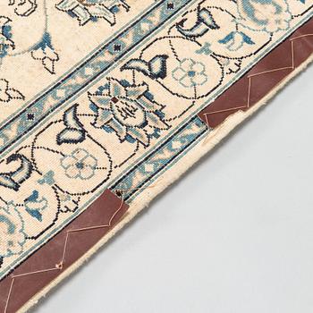 A carpet, Nain Part Silk. Ca 185 x 123 cm.