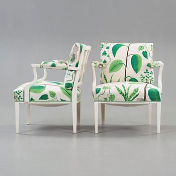 A pair of Josef Frank white laquered armchairs, Svenskt Tenn, model 969.