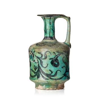 339. A Kashan turquoise blue-glazed ewer, central Persia (Iran), 11th to 12th century.