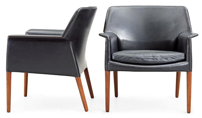 A pair of black leather easy chairs by Ejner Larsen and A Bender Madsen by Willy Beck, Denmark.