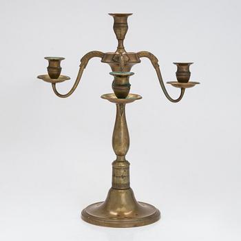 A brass candelabra signed Leander Helander 1856.