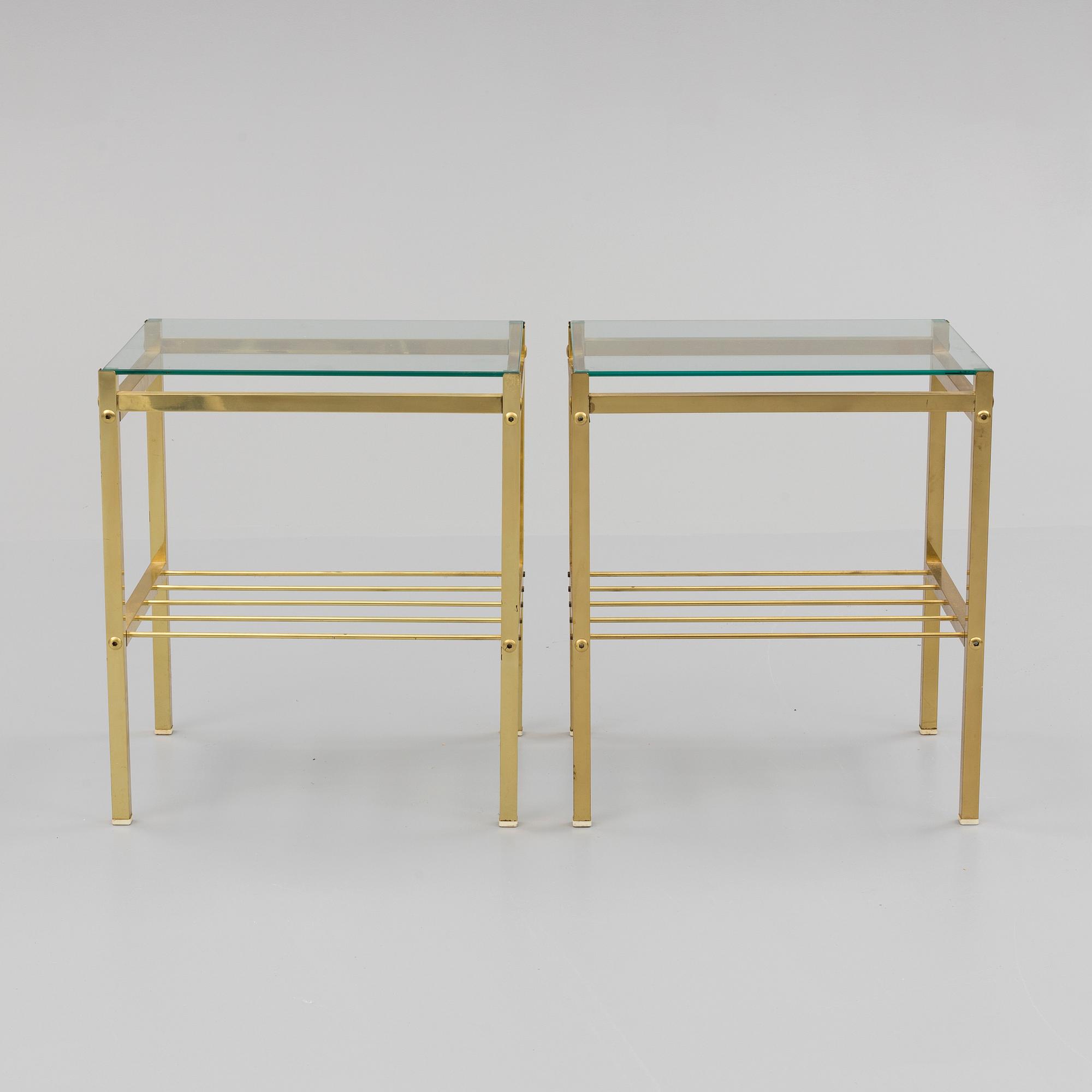A pair of brass and glass tables, second half of the 20th century.
