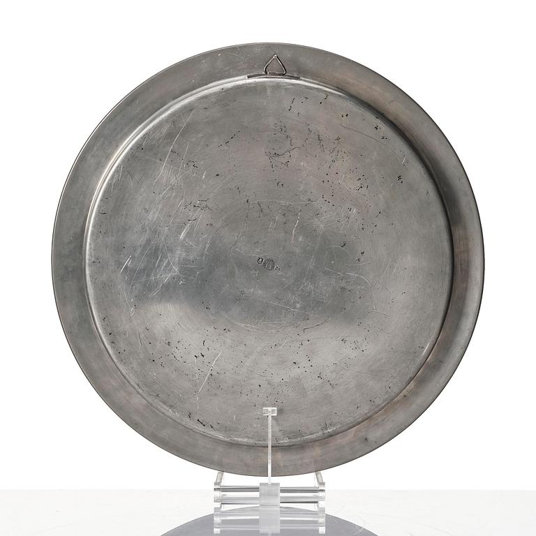 Firma Svenskt Tenn, a set of two pewter trays, Stockholm, 1930 and 1927.