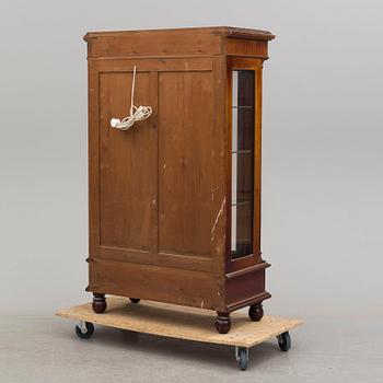 A mahogany veneered Empire style cabinet, circa 1900.