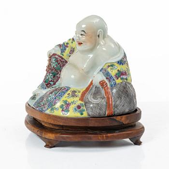 A Chinese famille rose porcelain figure of a Budai, around 1900.