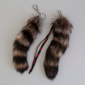 Two Bag accessories, by Marni and Miu Miu.