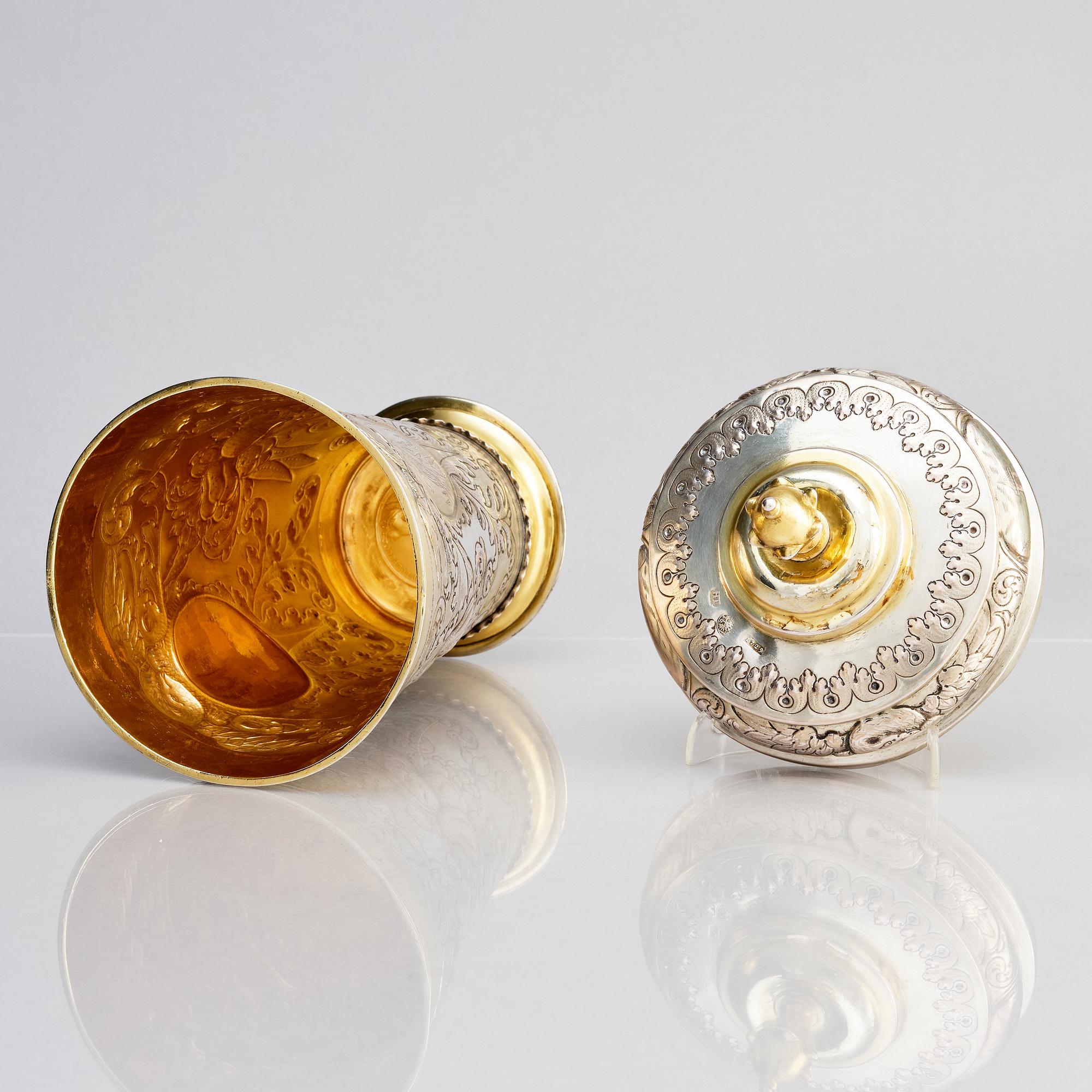 A pair of Russian Baroque parcel-gilt silver cups and covers, mark of Nikifor Timofeev, Moscow 1729.