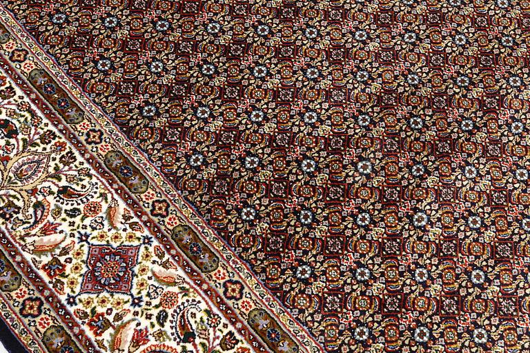 A Moud part silk carpet, signed, 335 x 250 cm.