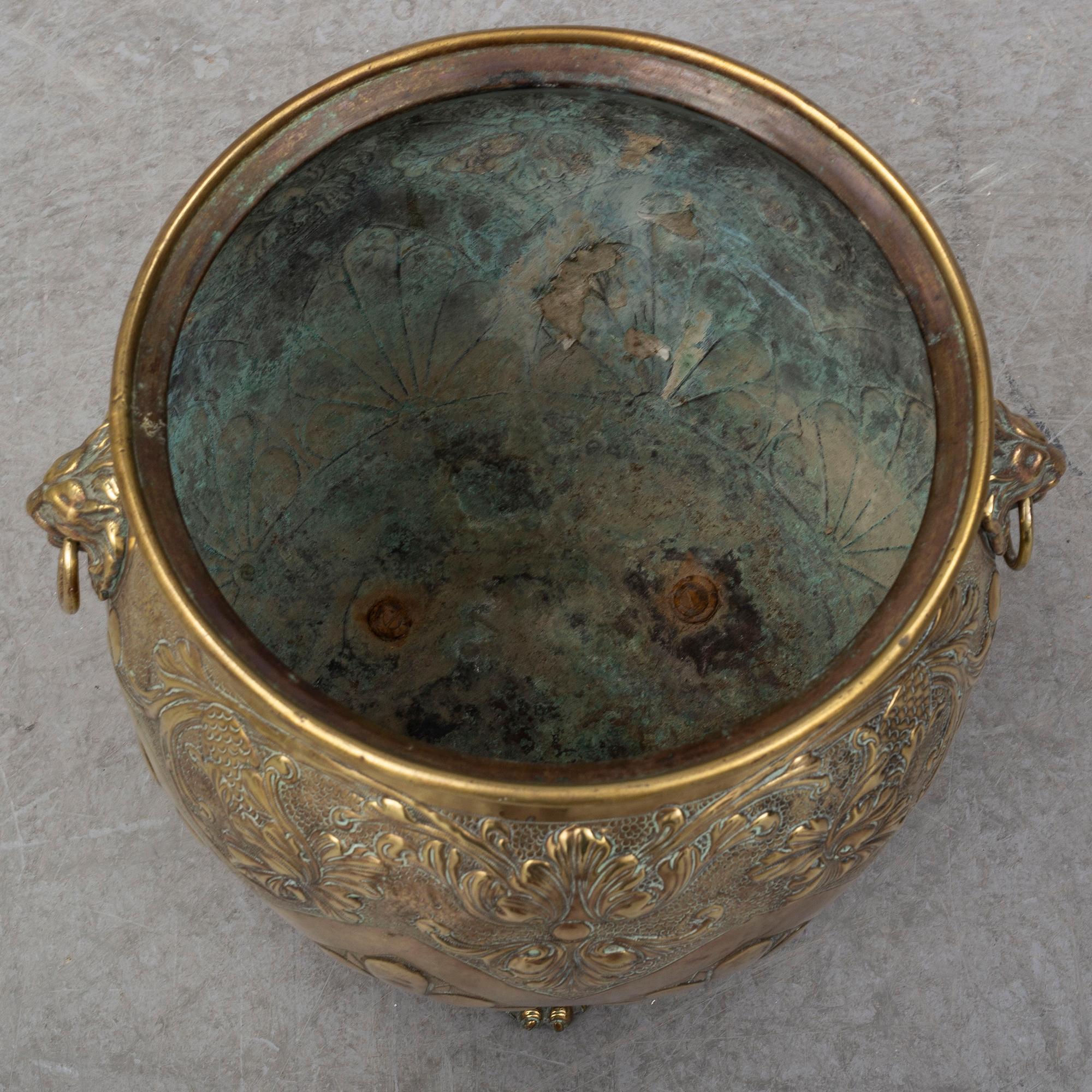 An 18th century brass flower pot.