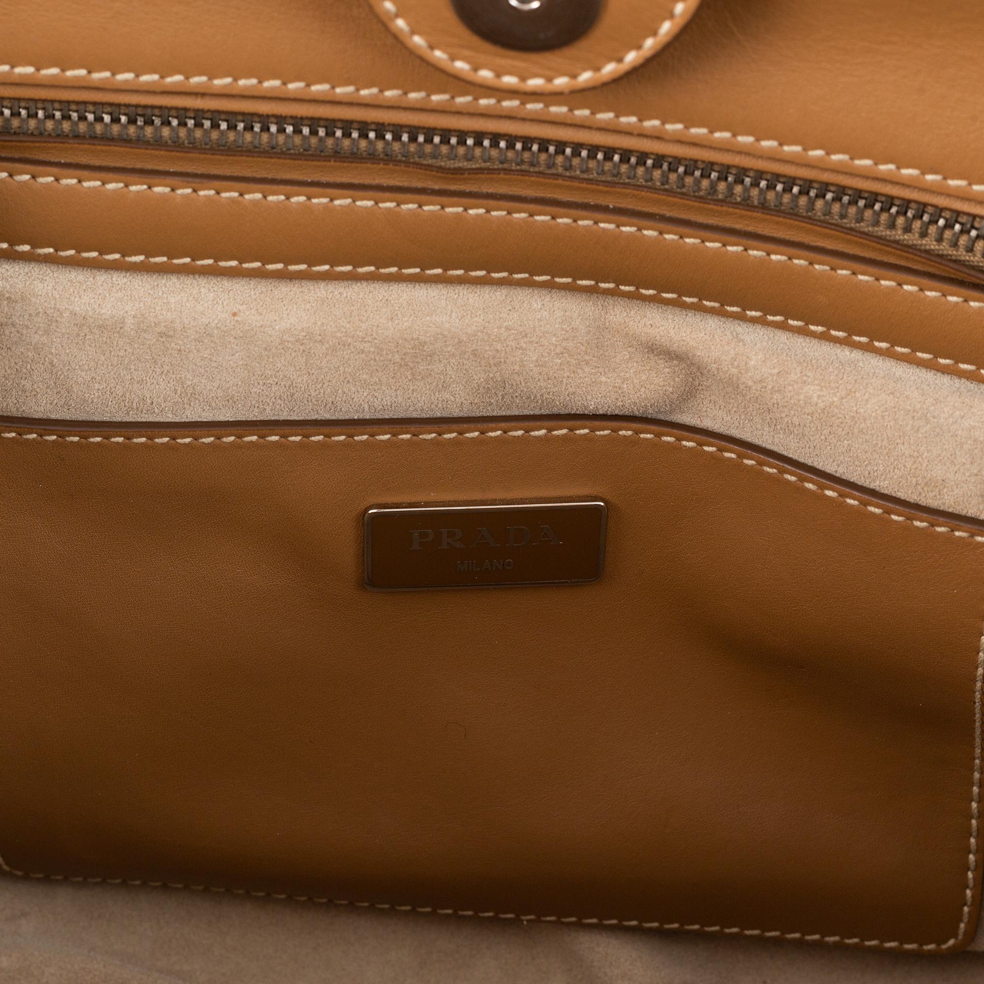 Prada, a leather handbag.