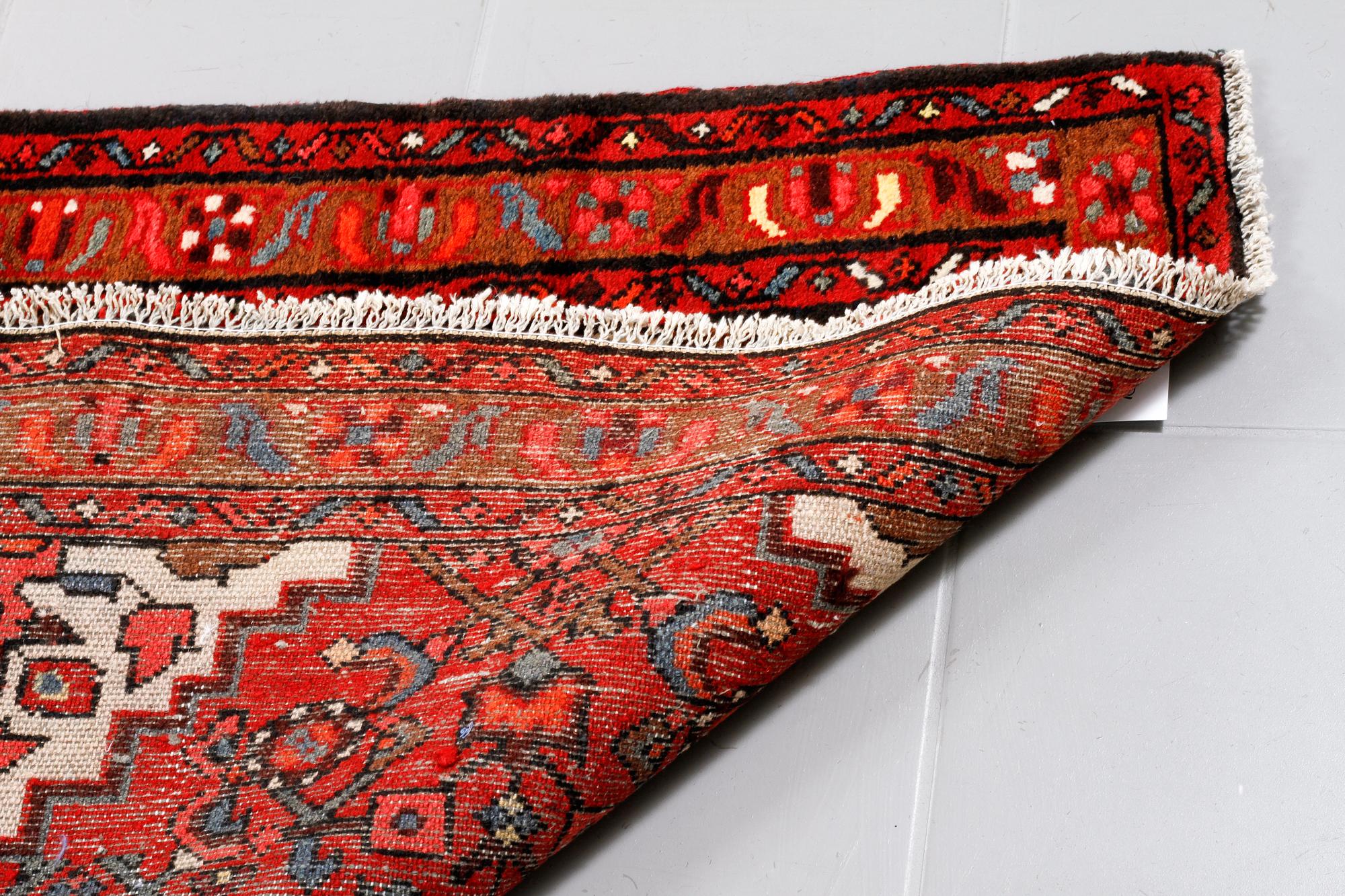 A Hosseinabad runner, 300 x 98 cm.