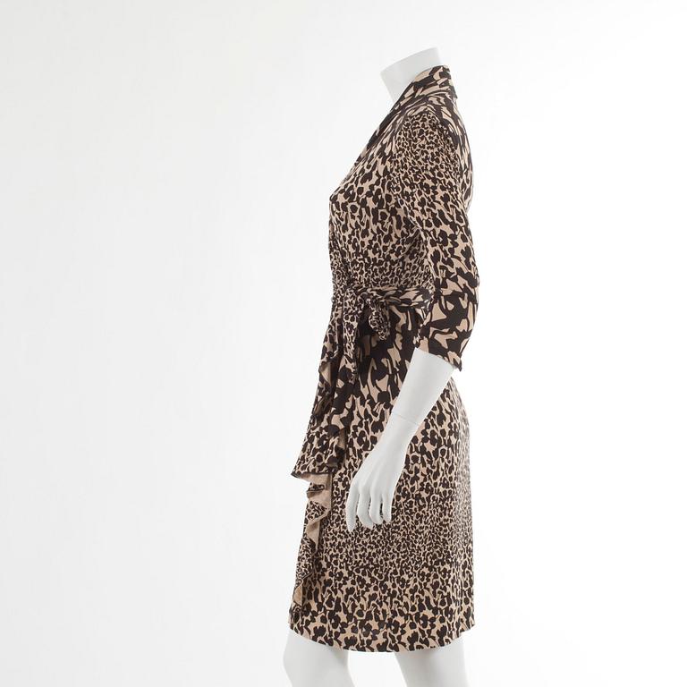 DIANE VON FURSTENBERG, a beige and brown printed silk wrap dress. Size US 6.
