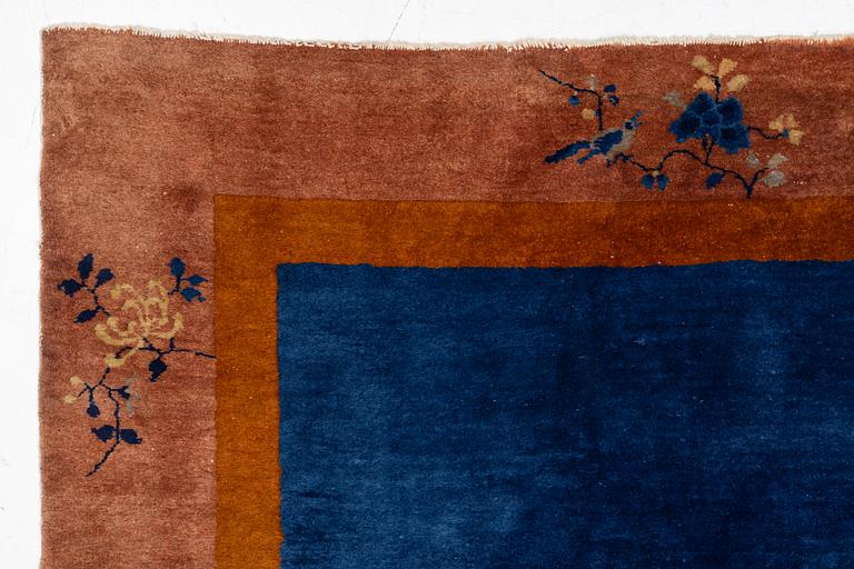 A Chinese art deco carpet, c. 327 x 278 cm.