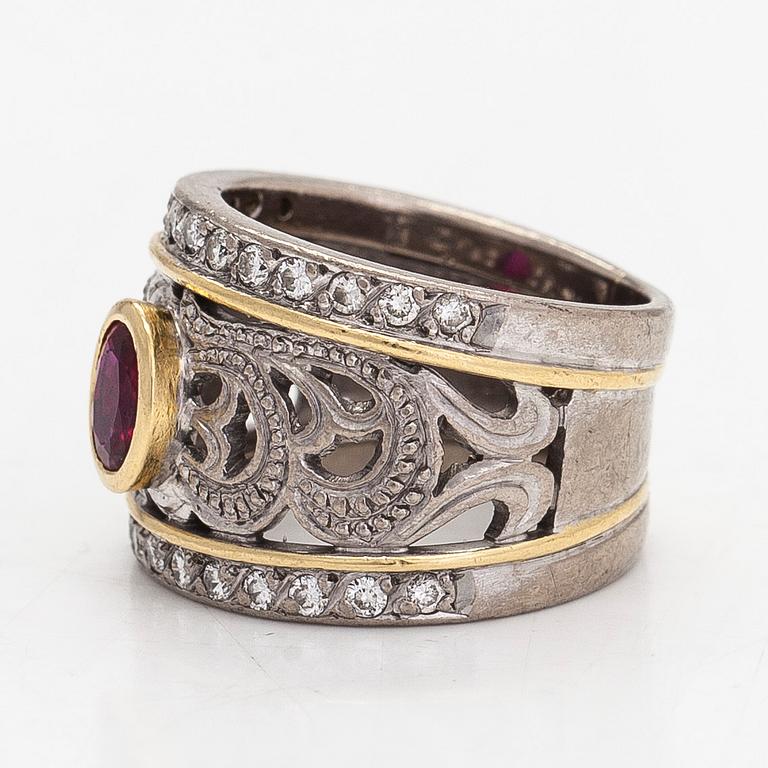 An 18K gold ring, oval ruby and diamonds totaling approx. 0.26 ct.