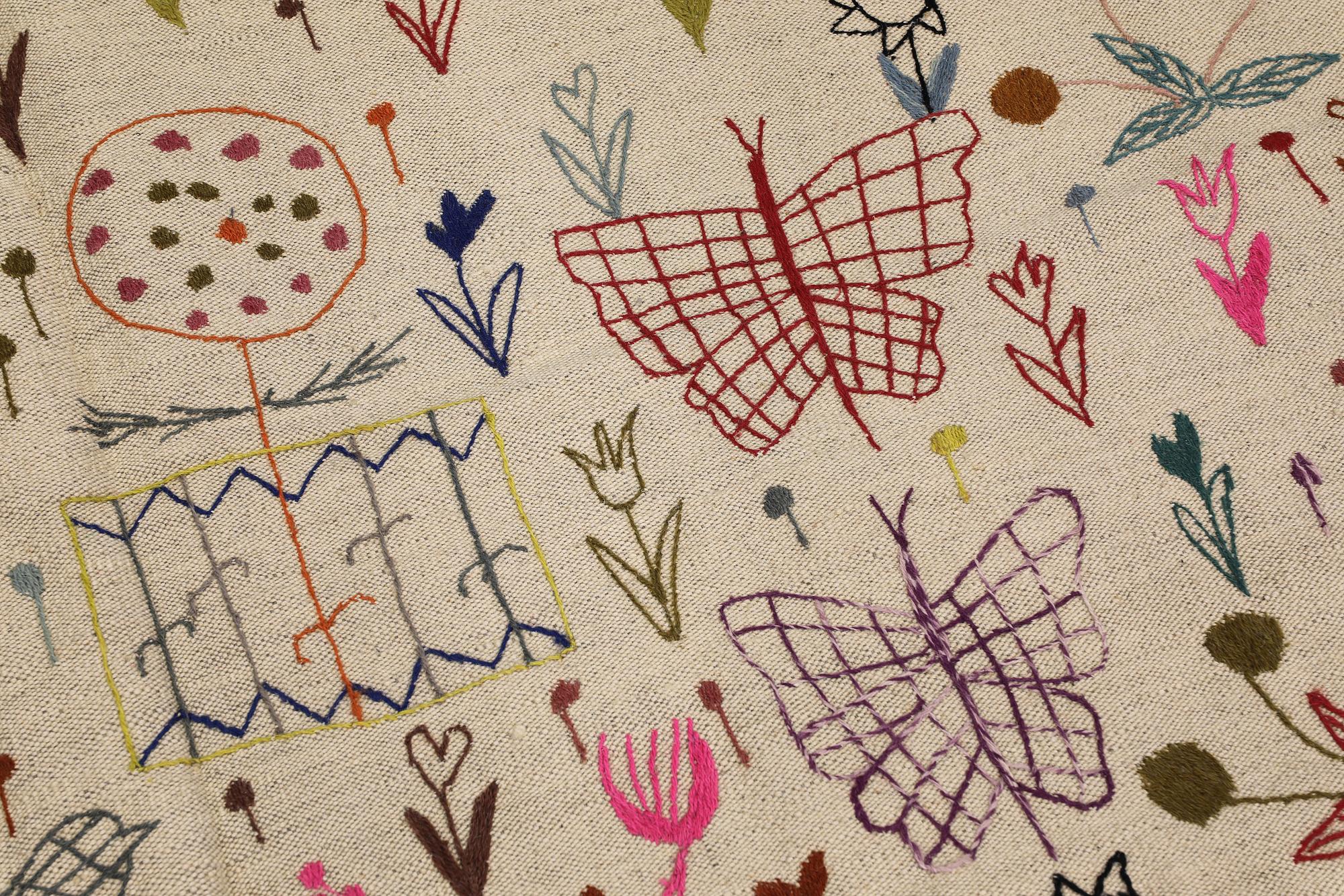 A Kelim rug, hand-embroidered, 241 x 179 cm.
