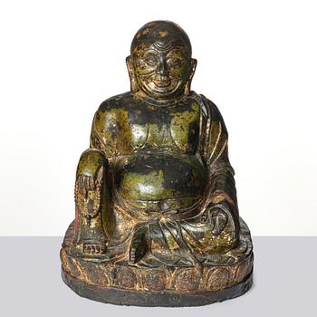 A large seated bronze figure of Budai, Ming Dynasty, dated to the fifth year of Jiajing (1526).