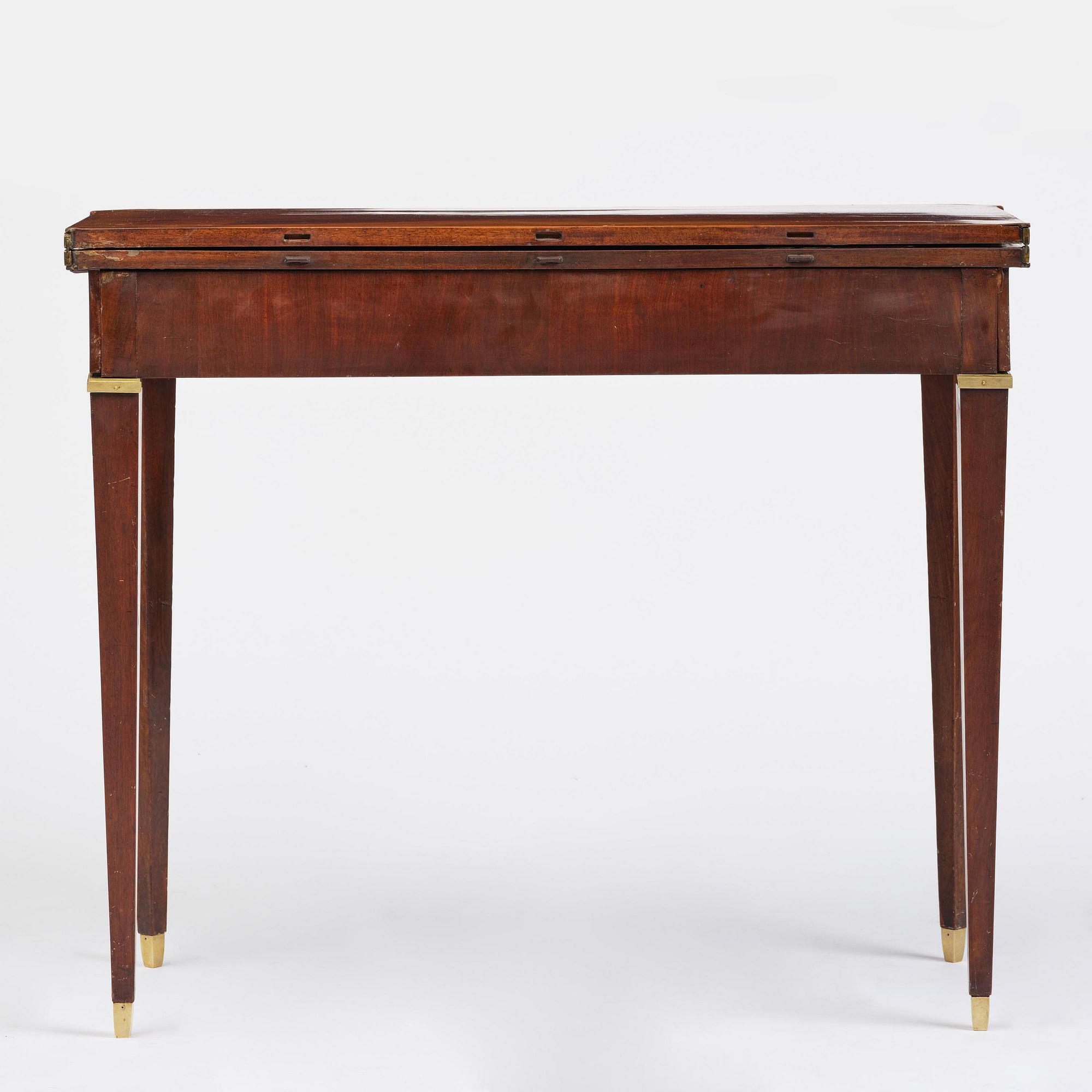 A Gustavian 'concertina action' mahogany games table by Georg Haupt (master in Stockholm 1770-84).