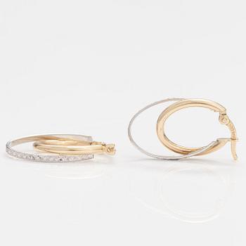 A pair of 14K gold earrings.