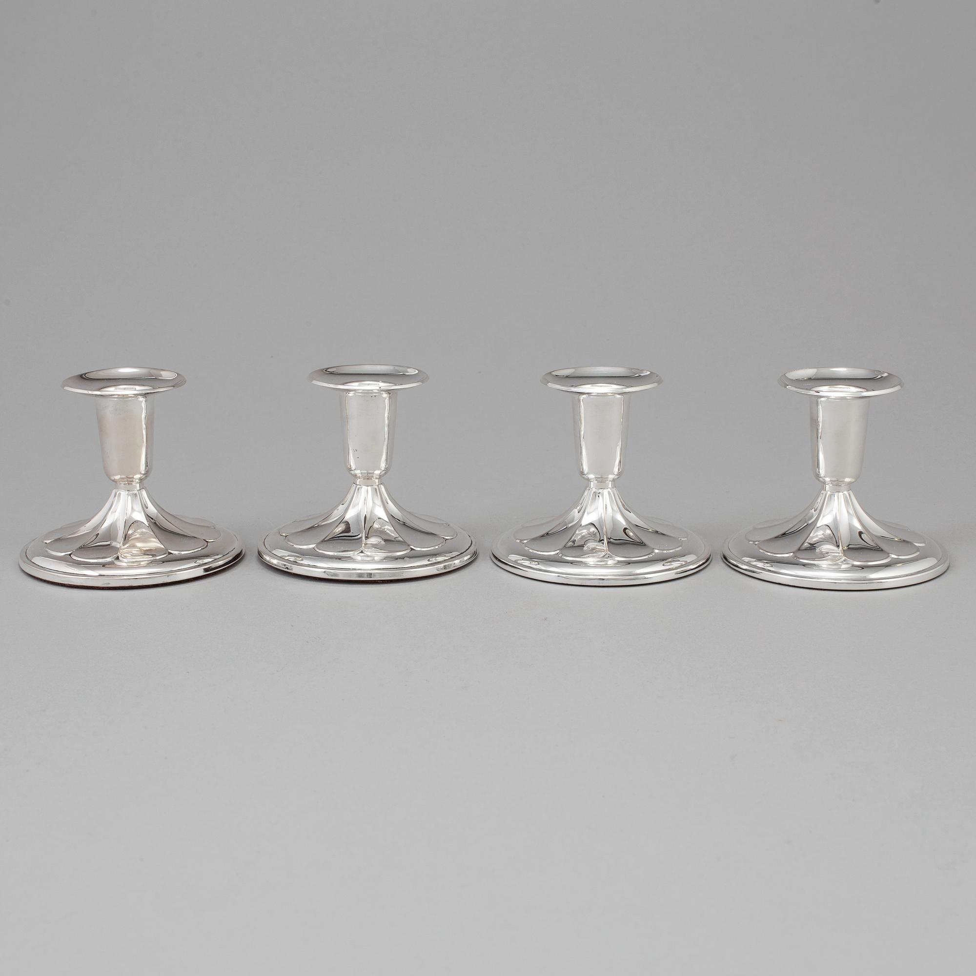 A set of four silver Candlesticks,
