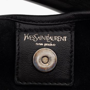 Yves Saint Laurent, a black leather and horn hobo bag.