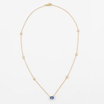 Necklace in 18K gold with a faceted heart-shaped sapphire and round brilliant-cut diamonds.