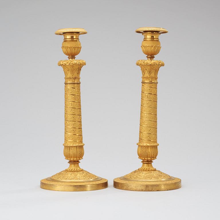 A pair of French Empire early 19th century candlesticks.