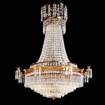 111. A gilt brass and cut glass nine-light Empire chandelier, first part of the 19th Century.
