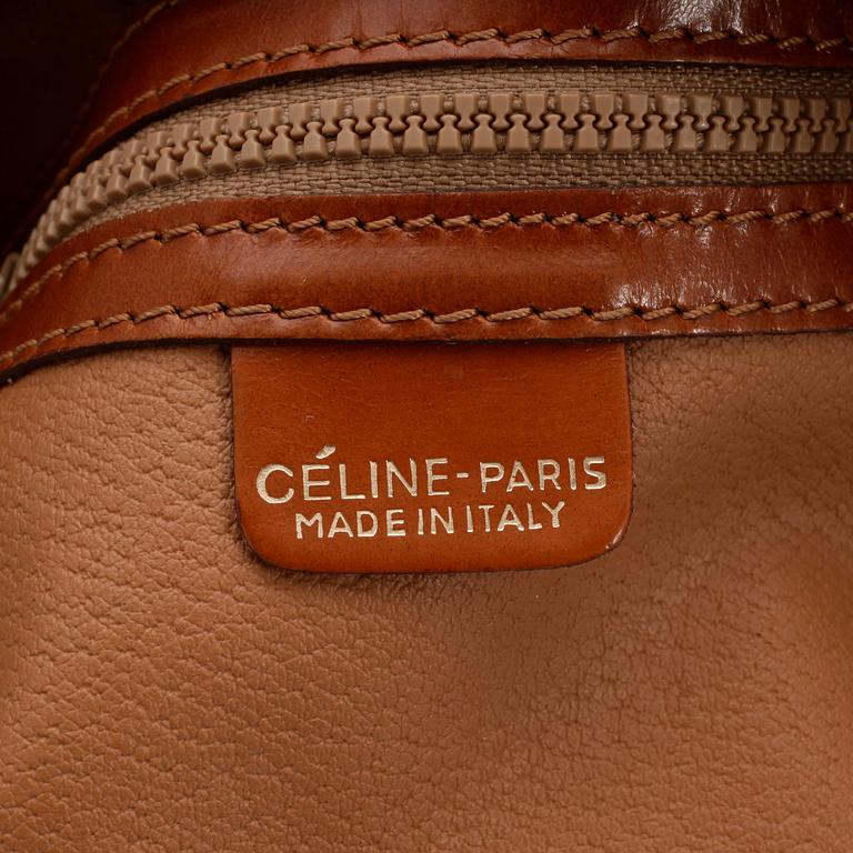 CÉLINE, a leather and canvas shoulder bag.