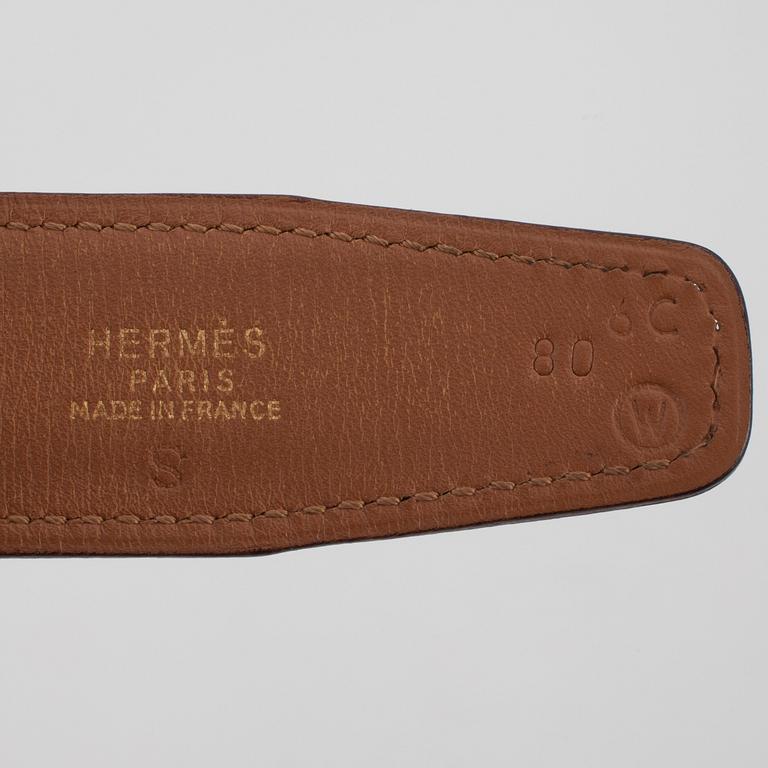 HERMÈS, a black leather belt.