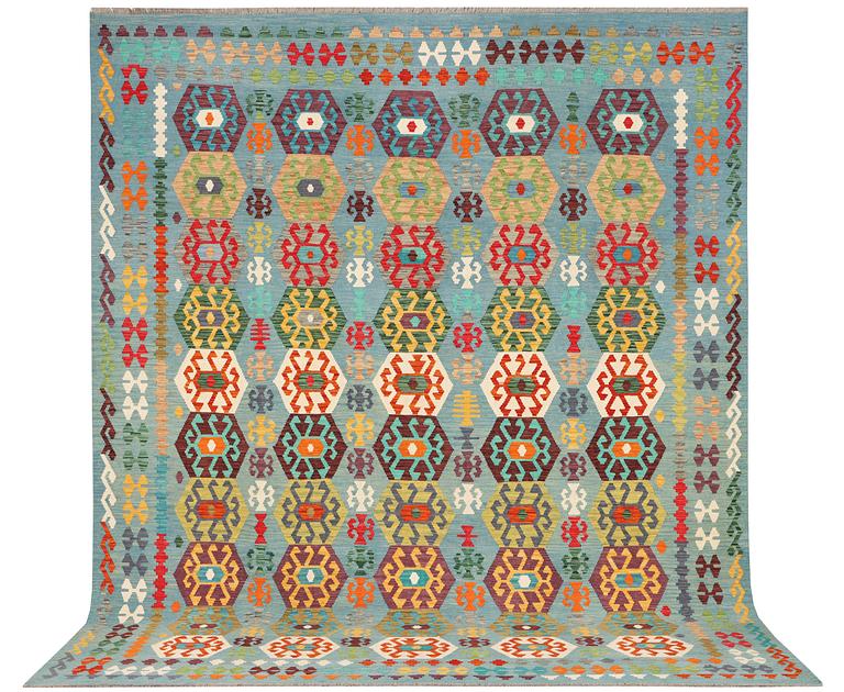 A Kilim carpet, c. 392 x 312 cm.