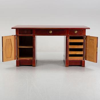 An Empire style writing desk, first half of/mid 20th century, and an Empire style chair, early 20th century.