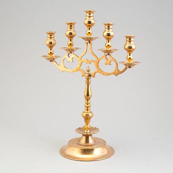 A pair of brass baroque style candelabra, early 20th century.