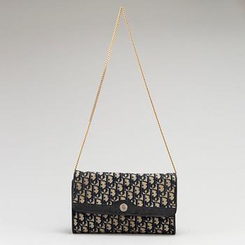 CHRISTIAN DIOR, a set of a clutch, a belt and an umbrella.