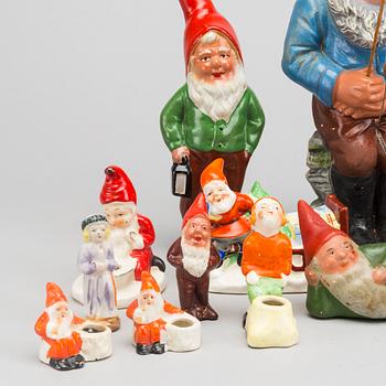 18 porcelain and pottery figurines and candleholders. First half of the 20th cetnury.