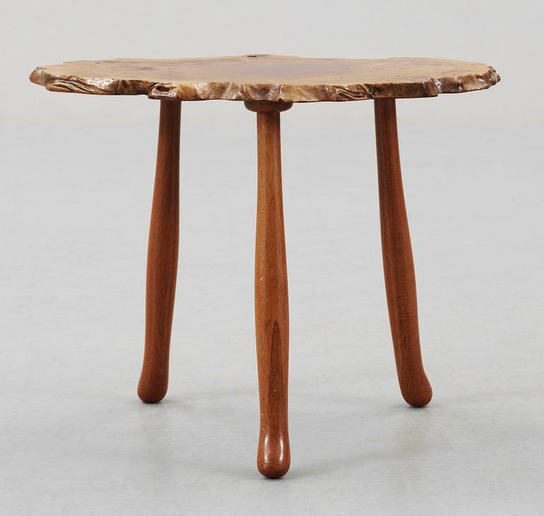 A Josef Frank elmroot and mahogany table by Svenskt Tenn.