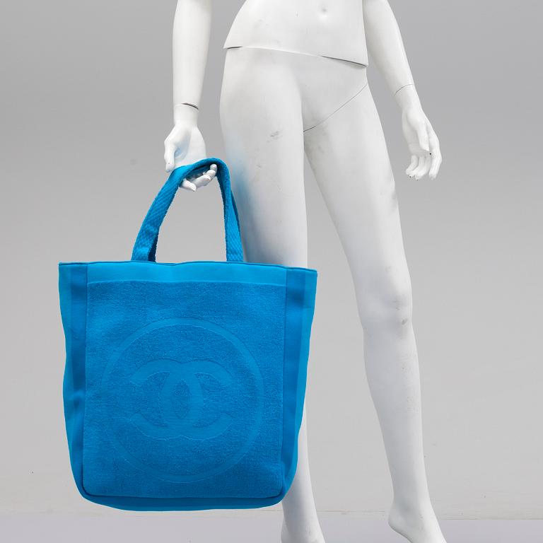 A Jumbo Bright Turquoise Blue "CC" Logo Cotton TERRY Cloth Beach Bag TOTE by Chanel and matching towel.