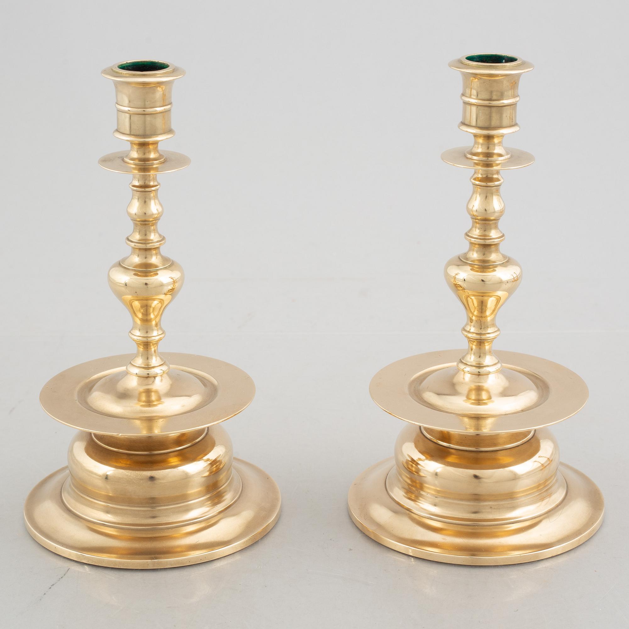 Two pairs of brass candlesticks, 19th century - early 20th century.